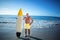 Senior man posing with a surfboard