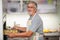 Senior man prepares healthy version of potatoes