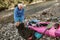 Senior man preparing for kayak tour on a mountain river