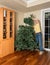 Senior man putting artificial christmas tree together for XMAS