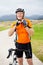 Senior man putting on cycling helmet