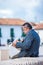 Senior man reading a newspaper at the Bolivar Square in Tunja city