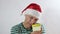 senior man in red sants hat holding golden gift box 4k