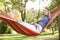 Senior Man Relaxing In Hammock