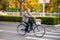 Senior man rides a bicycle at Beijing street