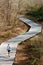 Senior Man Runs On Jogging Trail Made Of Wood Decking