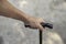 Senior man\'s hand holding walking cane to support himself as he walks  great details