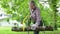 Senior man sawing a log handsaw closeup