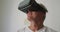 Senior man in social distancing using VR headset