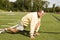 Senior man stretching exercising on sports field