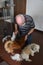Senior man strokes three small dogs