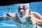 Senior man swimming in an indoor swimming pool.