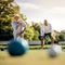 Senior man throwing a boules standing in position