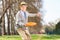 Senior man throwing a frisbee disk outdoors