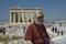 Senior man and tourists in Parthenon