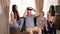 Senior man in virtual reality headset or 3d glasses having fun with family