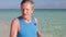 Senior Man Walking On Beautiful Beach