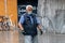 Senior man walking under the rain during Covid Lockdown Barcelona Spain