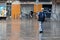 Senior man walking under the rain during Covid Lockdown Barcelona Spain