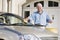 Senior man washing car