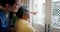 Senior, man in wheelchair and nurse pointing to outdoor view for healthcare support with caregiver in nursing home. Old