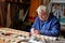 Senior man who makes the wing of a radio-controlled aircraft, the construction of the airplane