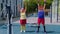 Senior man woman doing active training stretching muscles cardio fitness exercising on playground