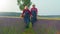 Senior man woman grandfather grandmother farmers gathering lavender flowers on summer field garden