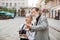 Senior man and woman hugging outdoors