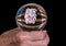 Senior mans hand holding a glass fortune telling ball to predict the results of the US election