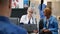 Senior medic showing diagnosis on laptop to sick patient