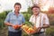 Senior men with harvested vegetables