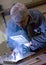 Senior metalworker welding
