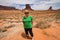 Senior middle aged woman 60s posing in front of Monument Valley utah