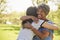 Senior Mother With Adult Daughter Hugging In Park