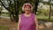 Senior old runner woman in park enjoying healthy active lifestyle. Elderly female working out cardio