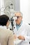 Senior ophthalmologist determines diopter to female patient