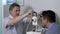 Senior optometrist doing sight testing for patient