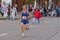 Senior participant hurrying to finish line during `Dnepr Eco Marathon` race on the city street