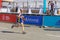 Senior participant hurrying to finish line during Interipe Dnipro Half Marathon race on the city street