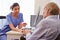 Senior Patient Having Consultation With Nurse In Office