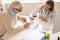 Senior patient with pen pointing at medical document while consulting doctor