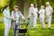 Senior patients with caregiver in the garden of nursing home