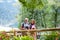 A senior pensioner couple with binoculars hiking, walking.