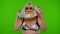 Senior pensioner woman tourist dancing, celebrating, smiling with rubber swim ring on chroma key