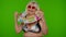 Senior pensioner woman tourist dancing, celebrating, smiling with rubber swim ring on chroma key