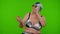 Senior pensioner woman tourist in swimsuit bra, swim goggles and hat dancing celebrating, smiling