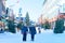 Senior people passing by Lordi Square in winter Rovaniemi