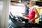 Senior people running in machine treadmill at fitness gym club