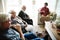 Senior people sitting together in a living room